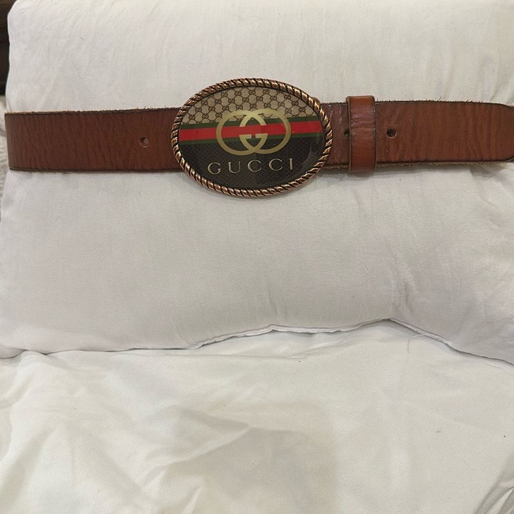 Genuine full grain leather size 34 with holes to make it smaller.logo on buckle